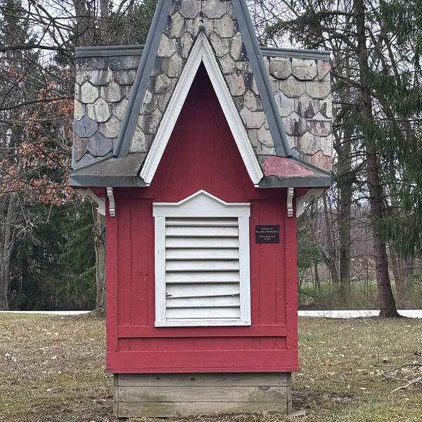 a red turret from an old building, set on the ground